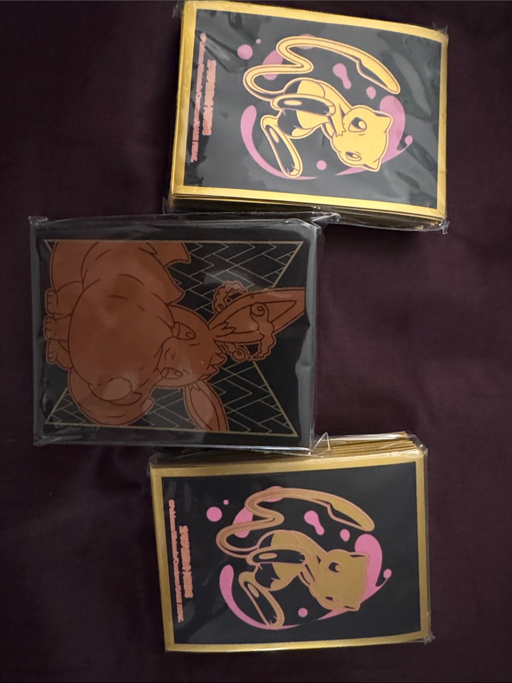 Pokemon Black, Gold & Pink Eevee and Mew Sleeve Trio